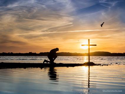 man_kneeling_prayer_cross_water_1.jpg